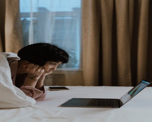 Person looking away from screen, resting